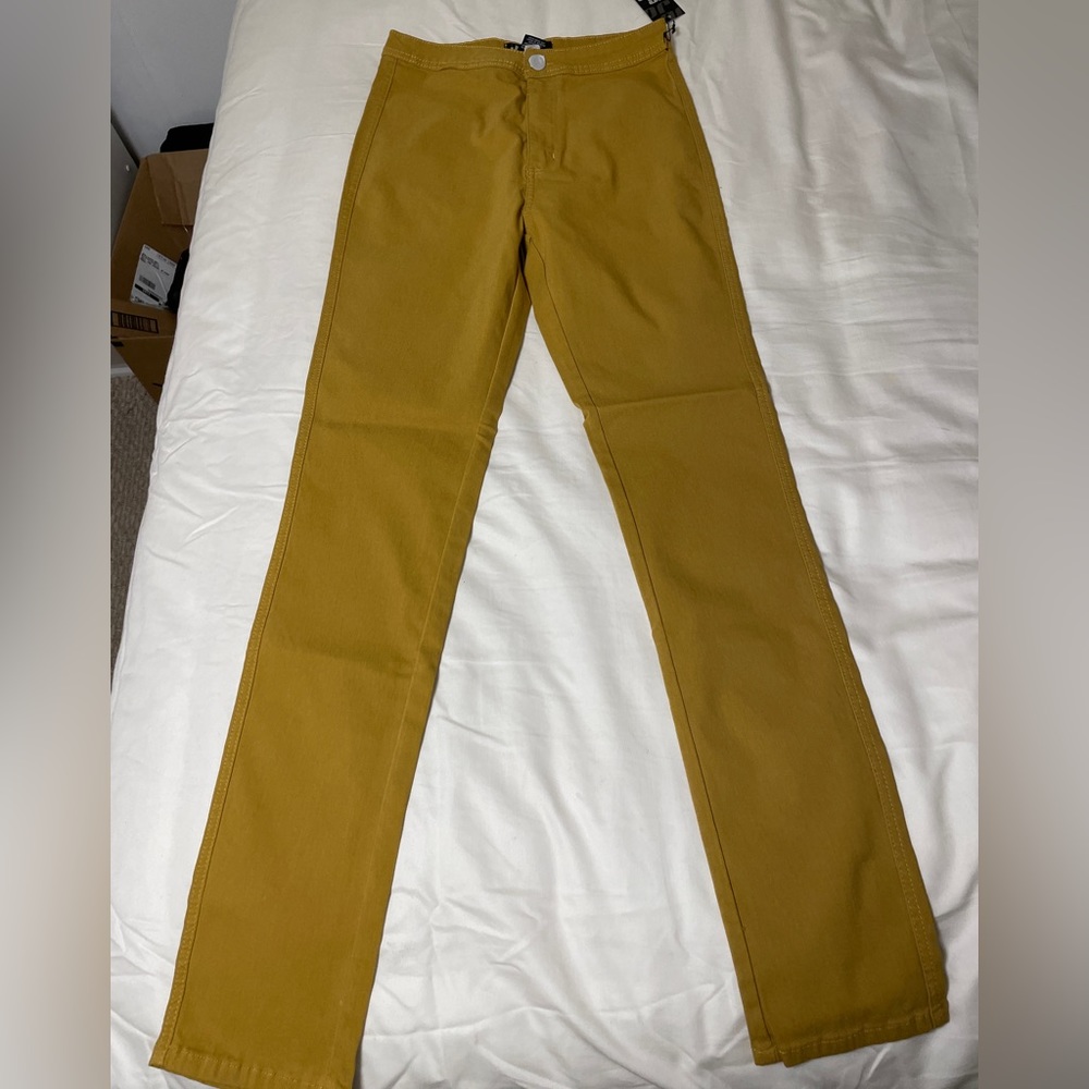 Size 1X straight stretchy pants. Mustard color. New with tags